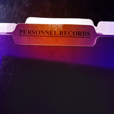 File with "personnel records" on a label