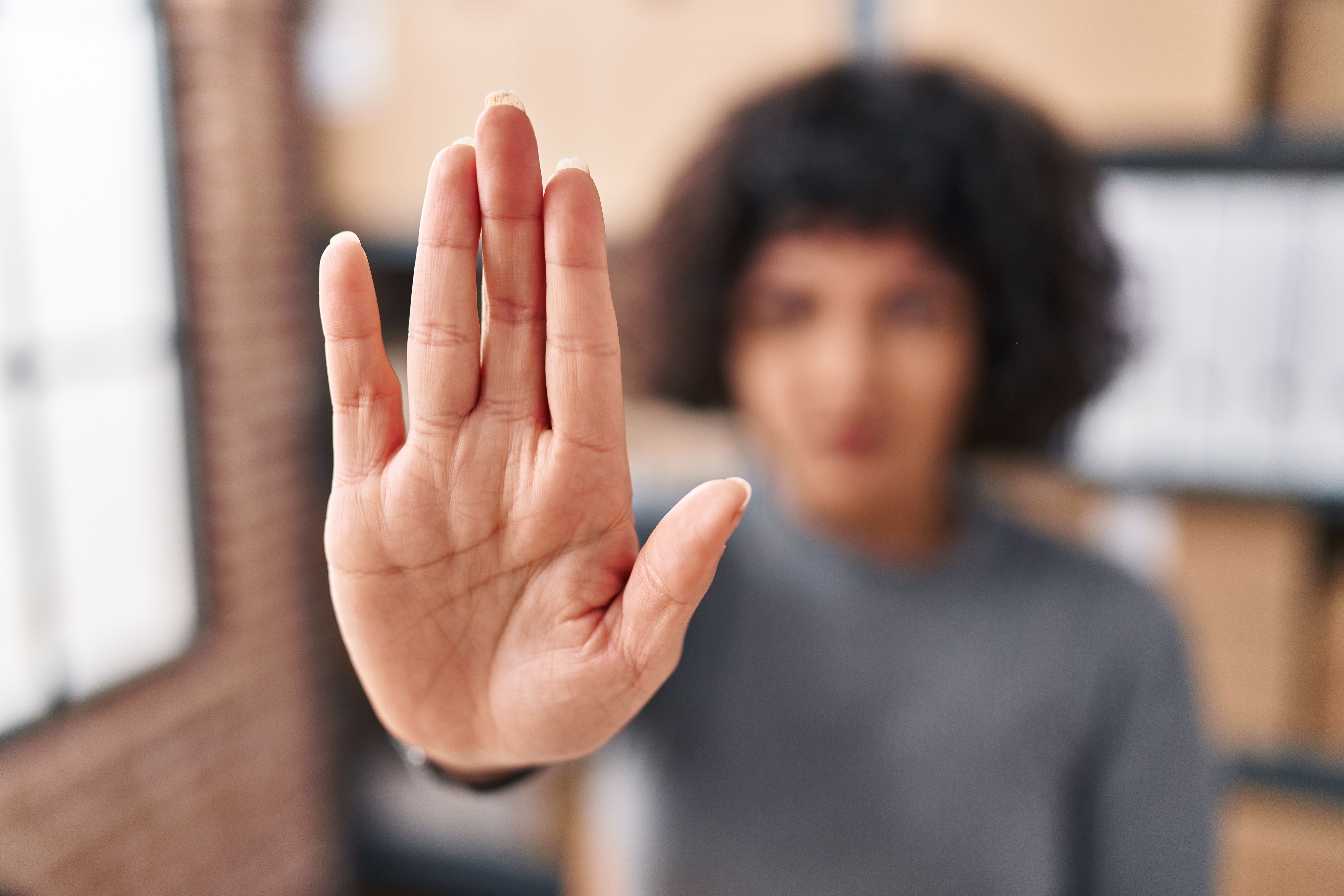 Woman Holding Up Hand