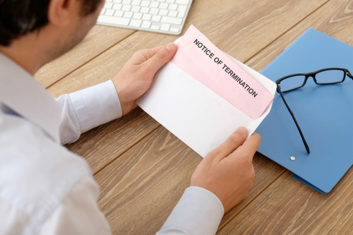 person holding envelope