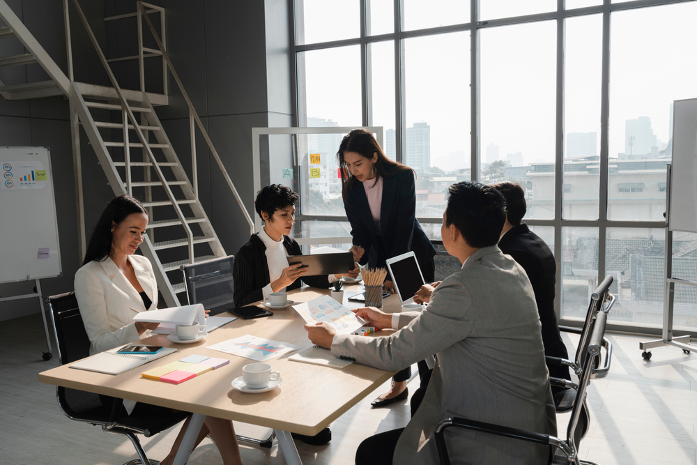 Business leaders discussing around a table