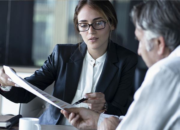 Professional Woman Looking Over Paperwork