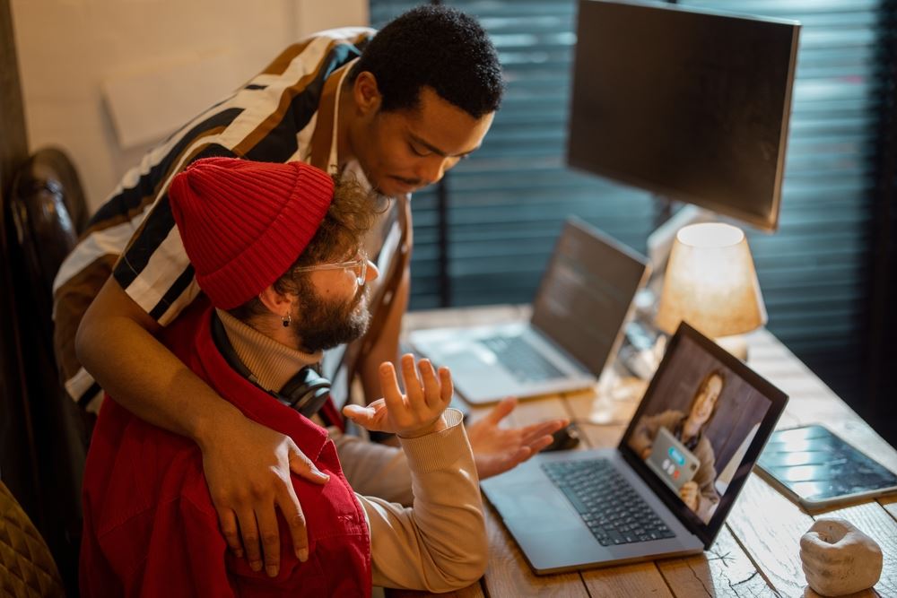 LGBT Couple Working From Home